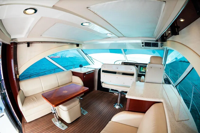  Yacht Photos Pics Luxurious interior of 2008 Sea Ray 60 Sundancer yacht with elegant seating and ocean view.