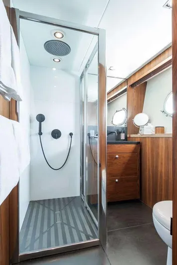  Yacht Photos Pics Luxurious bathroom in 2014 Sunseeker 131 yacht with modern shower and wooden cabinetry.