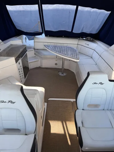 Sea Of O Yacht Photos Pics 2015 Sea Ray 350 SLX boat interior with white seating and a central table.