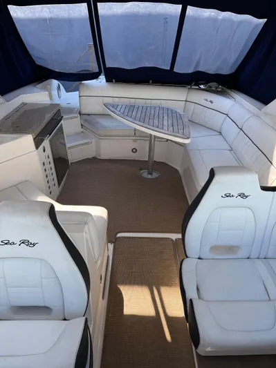 Sea Of O Yacht Photos Pics 2015 Sea Ray 350 SLX boat interior with white seating and a wooden table.