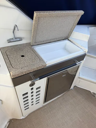 Sea Of O Yacht Photos Pics Outdoor kitchenette on 2015 Sea Ray 350 SLX boat with sink and mini fridge.