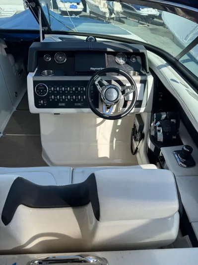 Sea Of O Yacht Photos Pics 2015 Sea Ray 350 SLX boat cockpit with steering wheel and control panel.