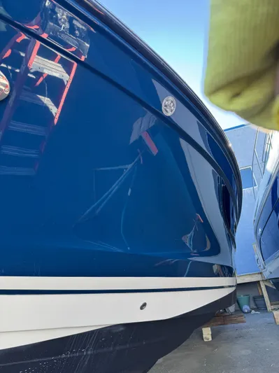 Sea Of O Yacht Photos Pics 2015 Sea Ray 350 SLX boat with sleek blue hull in a marina setting.