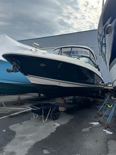 Sea Of O Yacht Photos Pics 2015 Sea Ray 350 SLX boat on dry dock, overcast sky background.