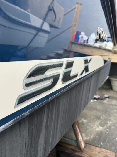 Sea Of O Yacht Photos Pics 2015 Sea Ray 350 SLX boat with SLX logo, docked in a marina.