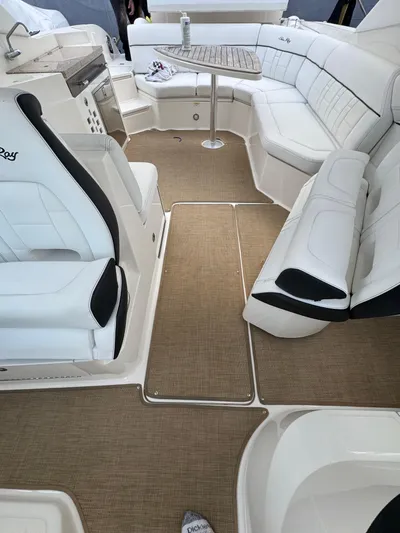 Sea Of O Yacht Photos Pics 2015 Sea Ray 350 SLX interior with white seating and beige carpet.