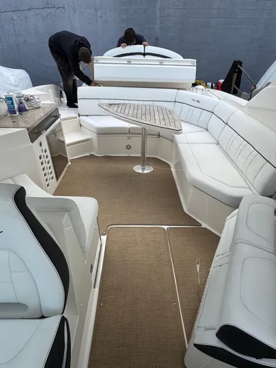 Sea Of O Yacht Photos Pics 2015 Sea Ray 350 SLX boat interior with white seating and a central table.