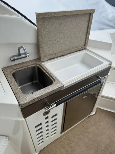 Sea Of O Yacht Photos Pics 2015 Sea Ray 350 SLX boat kitchenette with sink and storage.