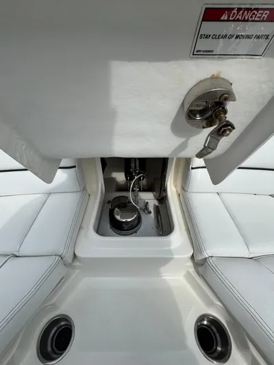 Sea Of O Yacht Photos Pics 2015 Sea Ray 350 SLX boat interior with open storage compartment and safety warning label.