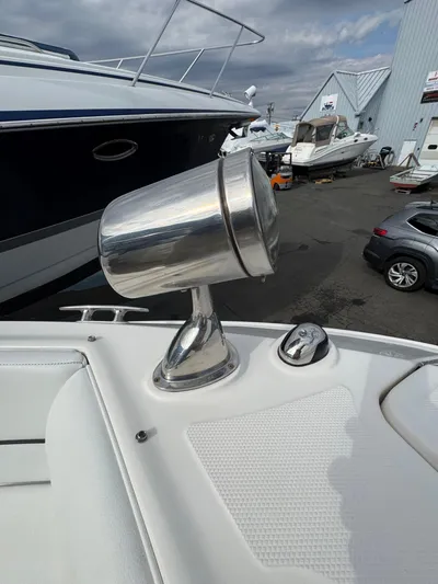 Sea Of O Yacht Photos Pics 2015 Sea Ray 350 SLX spotlight on deck, marina background with boats and cars.