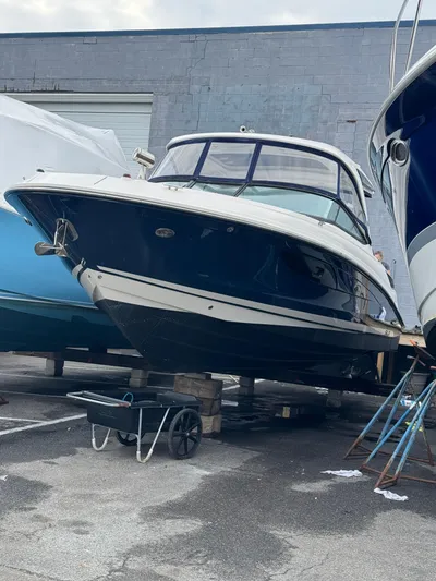 Sea Of O Yacht Photos Pics 2015 Sea Ray 350 SLX boat on blocks in a storage yard.