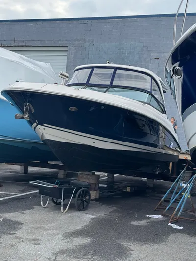 Sea Of O Yacht Photos Pics 2015 Sea Ray 350 SLX boat on blocks in a storage yard.
