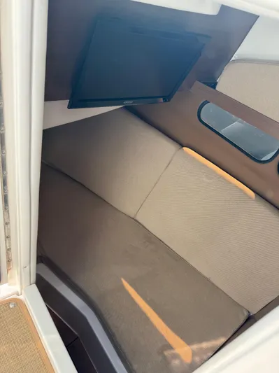 Sea Of O Yacht Photos Pics Interior cabin of 2015 Sea Ray 350 SLX boat with seating and window.