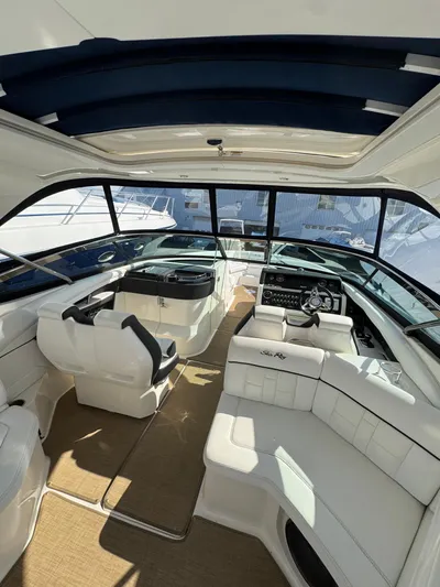 Sea Of O Yacht Photos Pics Interior of 2015 Sea Ray 350 SLX boat with luxurious seating and modern dashboard.