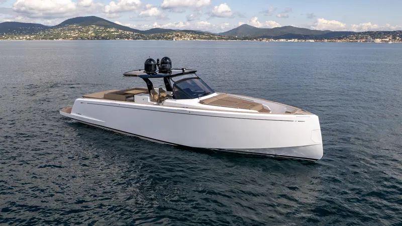  Yacht Photos Pics 2024 Pardo Yachts 50 cruising on calm waters with scenic mountain backdrop.