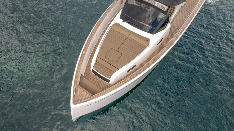  Yacht Photos Pics 2024 Pardo Yachts 50 cruising on clear blue water, showcasing sleek design and luxury features.