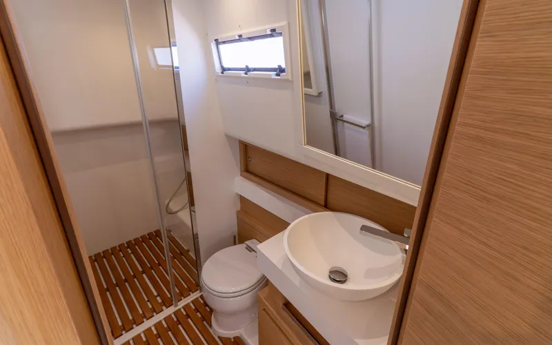  Yacht Photos Pics Bathroom interior of 2024 Pardo Yachts 50, featuring modern fixtures and wooden accents.