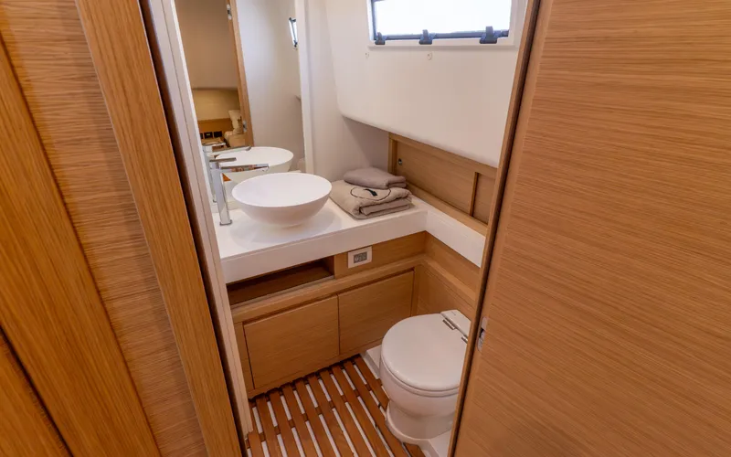  Yacht Photos Pics Luxurious bathroom in 2024 Pardo Yachts 50, featuring modern fixtures and wooden accents.