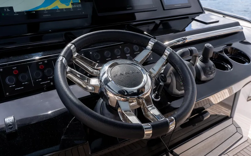  Yacht Photos Pics 2024 Pardo Yachts 50 steering wheel and control panel, featuring sleek design and modern technology.