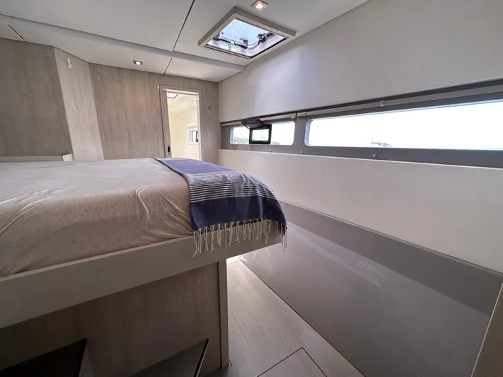  Yacht Photos Pics Interior of a 2019 Leopard 58 yacht featuring a modern bedroom design.