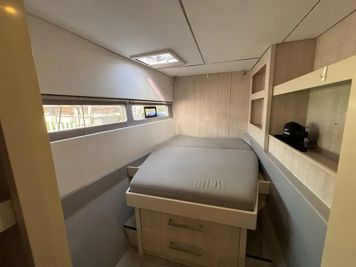  Yacht Photos Pics Interior of a 2019 Leopard 58 yacht, bedroom with bed and storage.