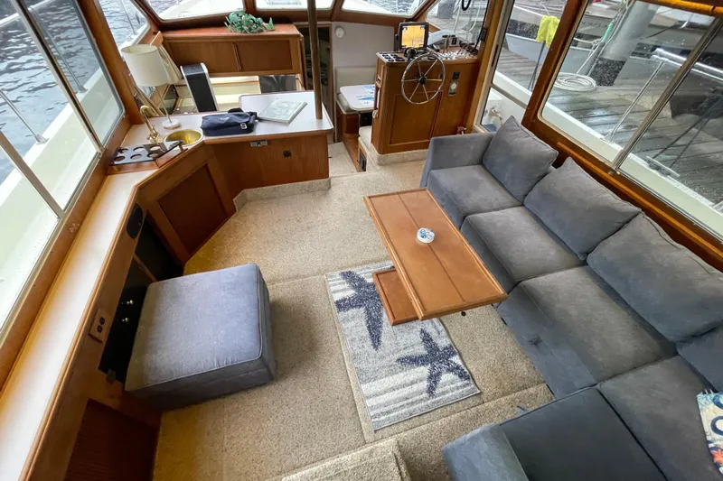 Blue Fish Yacht Photos Pics Interior of 1988 Tollycraft 44CPMY yacht with cozy seating and helm station.