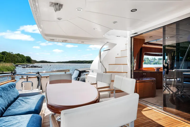  Yacht Photos Pics Luxurious Horizon Elegance 80 yacht deck with seating, table, and scenic water view.