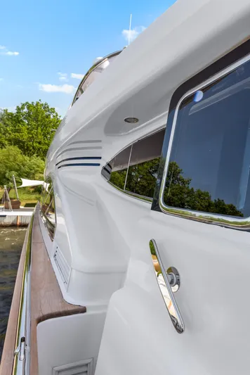  Yacht Photos Pics Side view of a 2000 Horizon Elegance 80 yacht with sleek design and reflective windows.