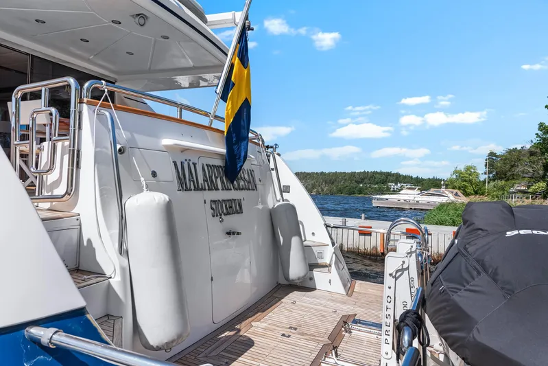  Yacht Photos Pics Luxury yacht Horizon Elegance 80 docked, Swedish flag, scenic waterfront view.