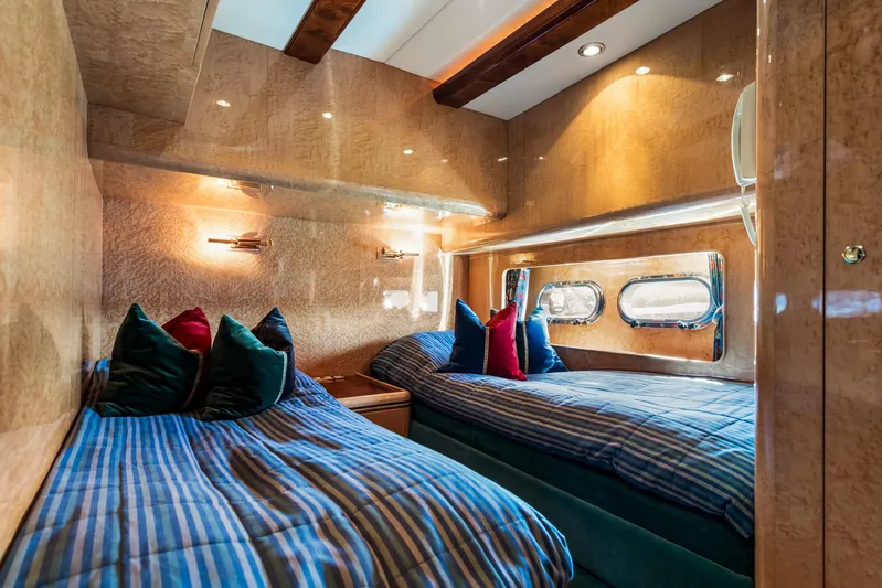  Yacht Photos Pics Luxurious twin cabin interior on 2000 Horizon Elegance 80 yacht with striped bedding.