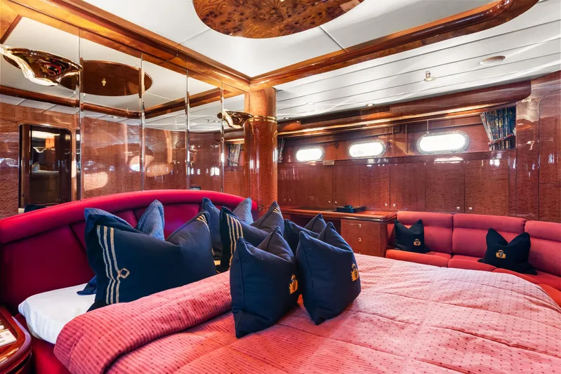  Yacht Photos Pics Luxurious bedroom interior on 2000 Horizon Elegance 80 yacht with plush red and blue decor.