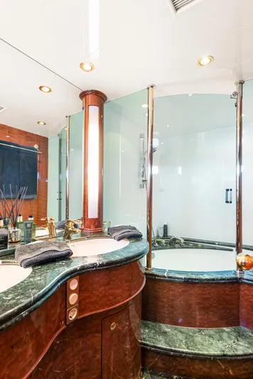  Yacht Photos Pics Luxurious yacht bathroom with marble countertops, elegant fixtures, and a spacious shower in Horizon Elegance 80.