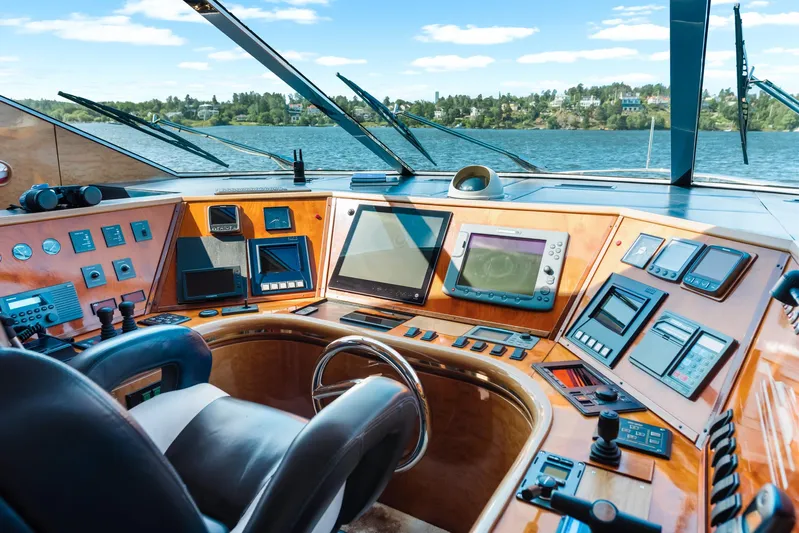  Yacht Photos Pics Cockpit of 2000 Horizon Elegance 80 yacht with advanced navigation controls and scenic water view.