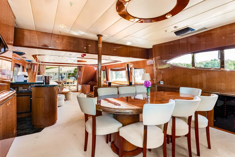  Yacht Photos Pics Luxurious interior of 2000 Horizon Elegance 80 yacht with elegant dining area and polished wood finishes.