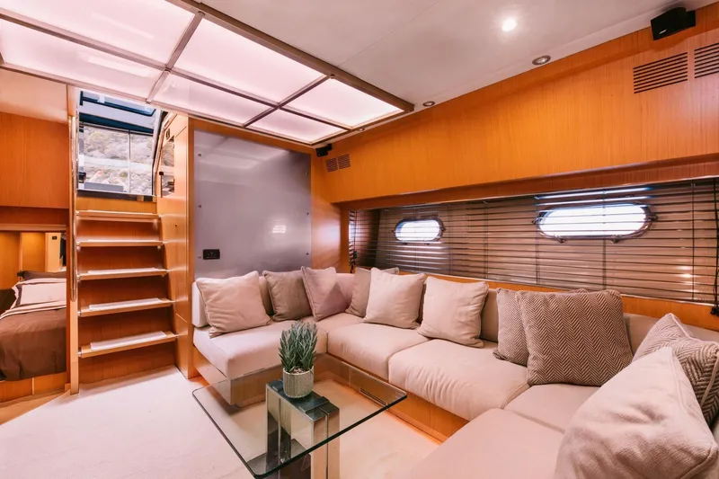 Who Cares Yacht Photos Pics Luxurious interior of 2006 Riva 68 Ego yacht with cozy seating and modern design.