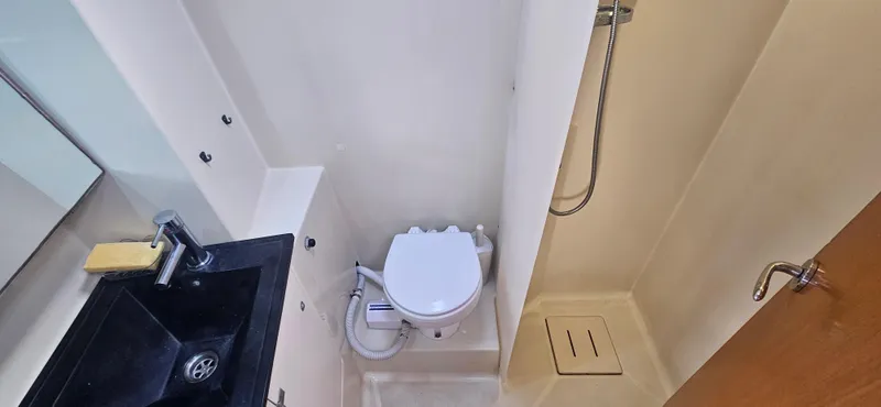  Yacht Photos Pics Bathroom interior of 2007 Dufour 425 Grand Large yacht with sink, toilet, and shower.