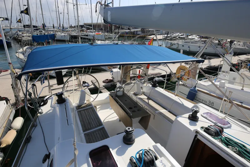  Yacht Photos Pics Dufour 425 Grand Large 2007 sailboat with blue canopy docked at marina.