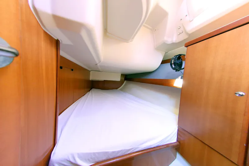  Yacht Photos Pics Cozy cabin interior of 2007 Dufour 425 Grand Large sailboat with wooden finish.