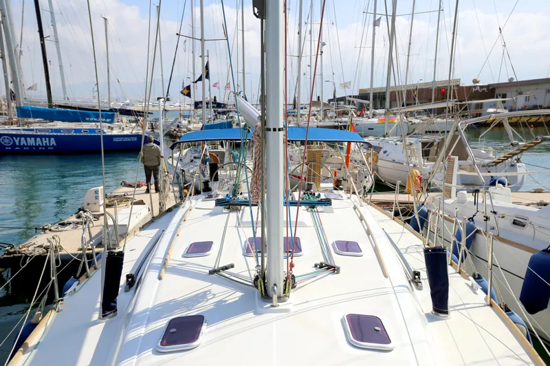  Yacht Photos Pics Dufour 425 Grand Large 2007 sailboat docked in a marina, surrounded by other boats.