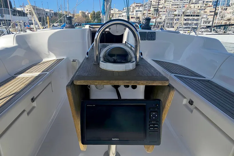  Yacht Photos Pics Cockpit of 2007 Dufour 425 GL sailboat with navigation equipment and cityscape background.