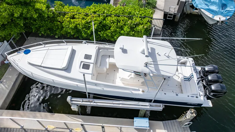 Yacht Photos Pics 2008 Intrepid 370 Cuddy boat docked, aerial view, white exterior, triple outboard engines.