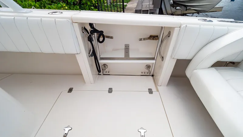  Yacht Photos Pics 2008 Intrepid 370 Cuddy boat interior with storage compartment and seating.