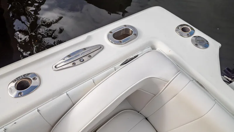  Yacht Photos Pics 2008 Intrepid 370 Cuddy boat interior with white seating and stainless steel fixtures.