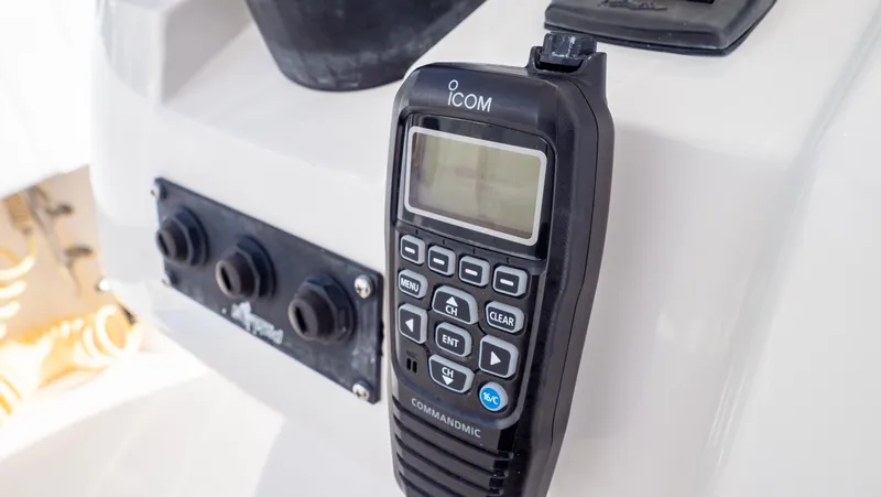  Yacht Photos Pics ICOM marine radio on 2008 Intrepid 370 Cuddy boat dashboard.