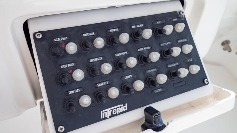  Yacht Photos Pics Control panel of a 2008 Intrepid 370 Cuddy boat with labeled switches.