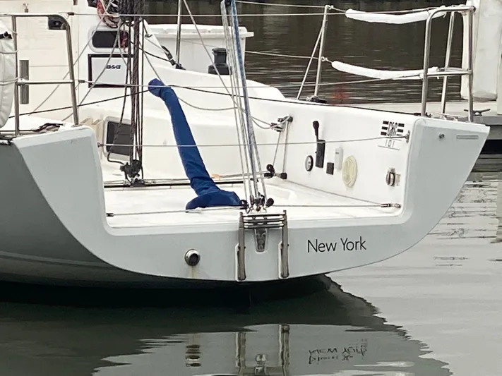 4817rf Yacht Photos Pics Sailboat Tartan 101, 2013 model, docked with "New York" on the stern.