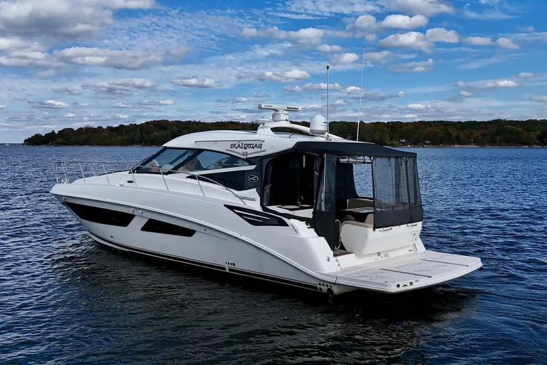 Skalywag VI Yacht Photos Pics 2015 Sea Ray 470 Sundancer yacht on calm water under a blue sky.