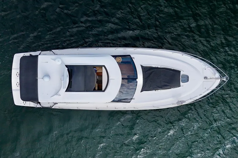 Skalywag VI Yacht Photos Pics Aerial view of 2015 Sea Ray 470 Sundancer yacht on open water.