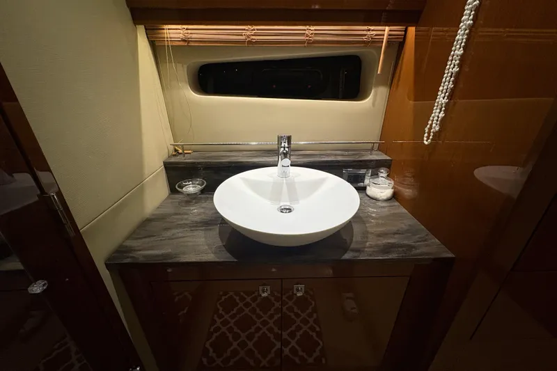 Skalywag VI Yacht Photos Pics Luxurious bathroom sink in 2015 Sea Ray 470 Sundancer yacht, featuring elegant design.