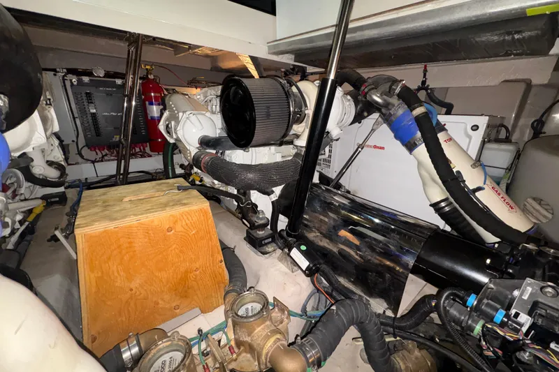 Skalywag VI Yacht Photos Pics Engine room of 2015 Sea Ray 470 Sundancer, showcasing mechanical components and equipment.